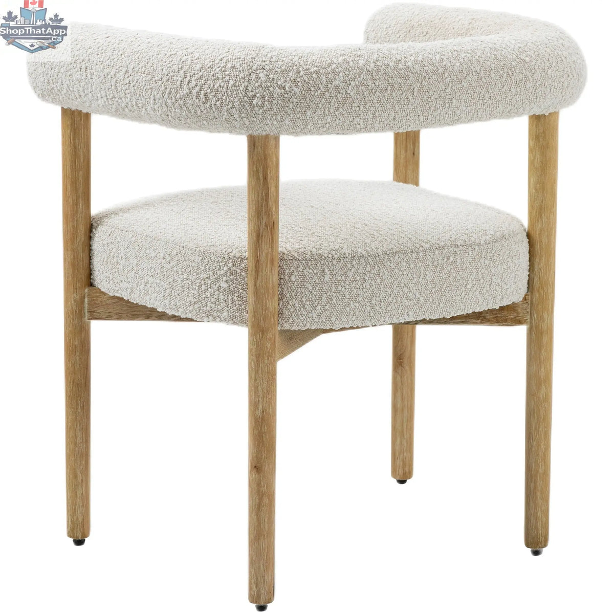 Elegant Oslo Cream Dining Chair by Hygge Design House with plush cream upholstery and sleek wooden legs.