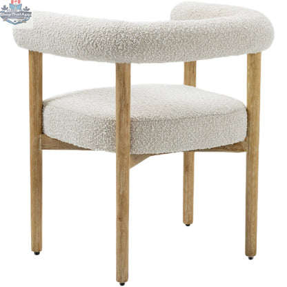 Elegant Oslo Cream Dining Chair by Hygge Design House with plush cream upholstery and sleek wooden legs.