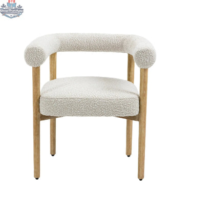 Cream Svea Boucle Dining Chair by Hygge Design House with rounded back and metal legs, showcasing a cozy, modern dining room style.