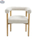 Cream Svea Boucle Dining Chair by Hygge Design House with rounded back and metal legs, showcasing a cozy, modern dining room style.