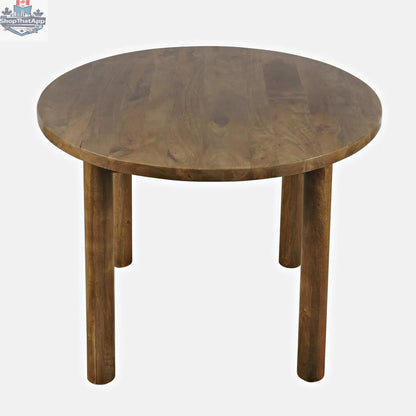 Hygge Design House Frigg round dining table with wooden finish, showcasing a smooth circular tabletop and sturdy base.