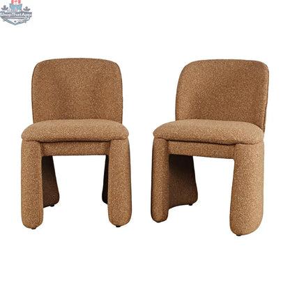 Hygge Design House Soma dining chair with beige fabric upholstery and wooden legs, stylishly displayed in a modern dining room setting.