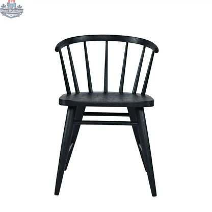 Fitz dining chair by Hygge Design House featuring a sleek black upholstered seat and modern wooden legs.