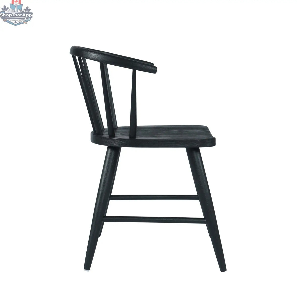 Fitz dining chair by Hygge Design House featuring a black upholstered seat and sleek wooden legs.