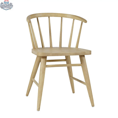Hygge Design House Fitz dining chair with wooden legs and upholstered fabric seat, shown from a front angle.