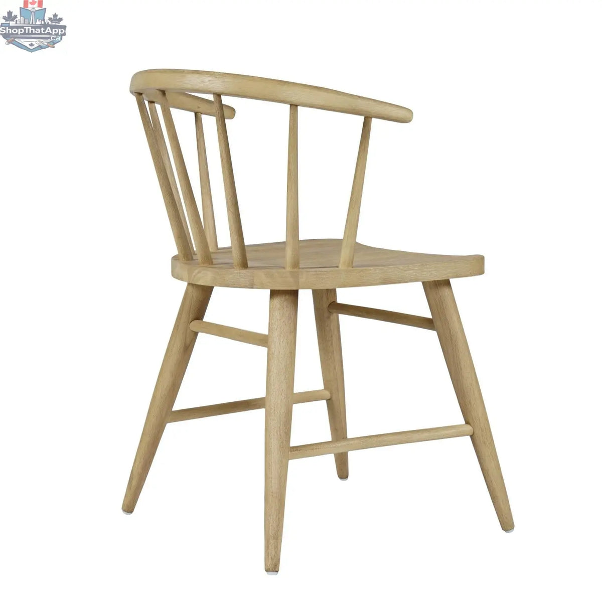 Hygge Design House Fitz dining chair shown from side angle with wooden legs and upholstered seat in a modern dining room setting.