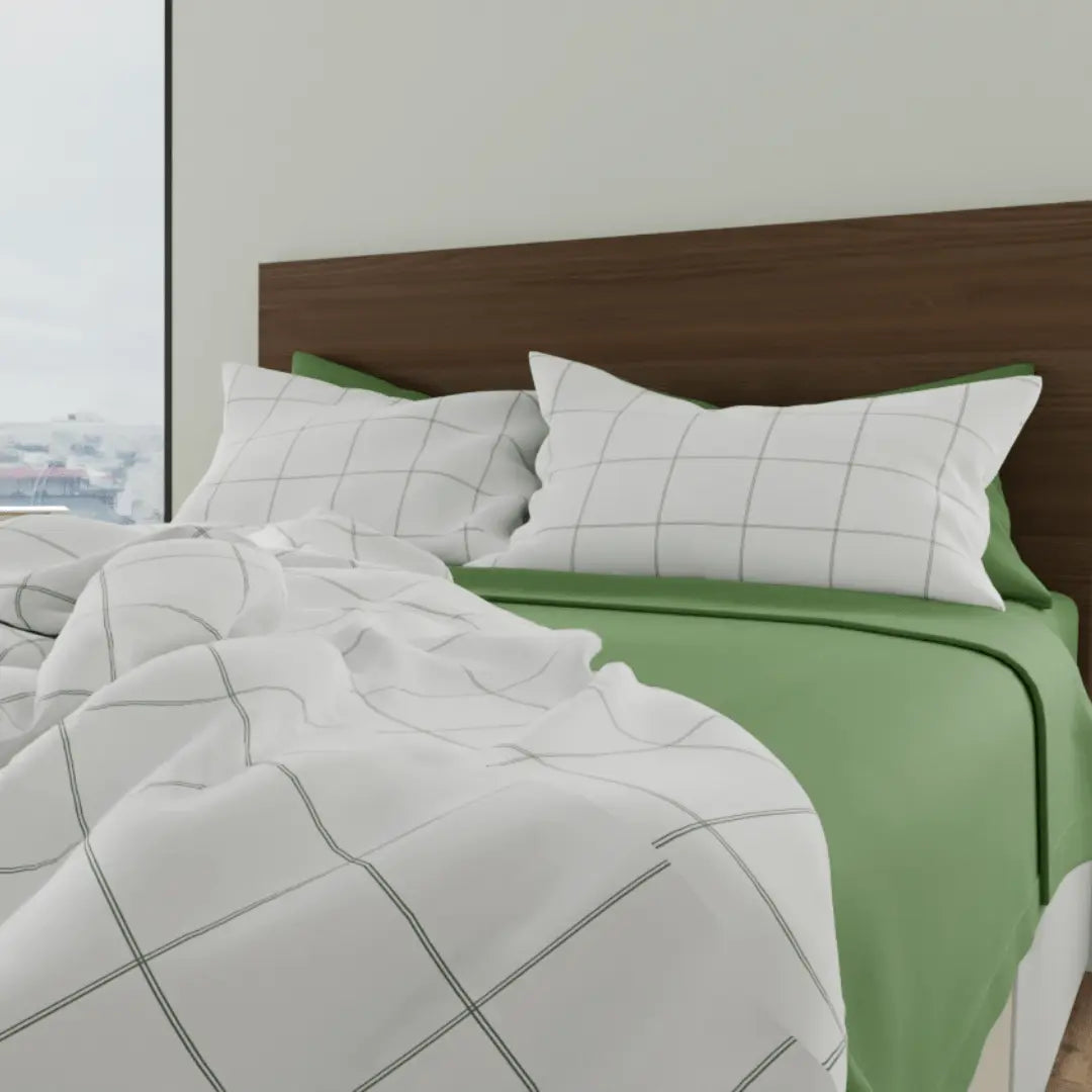 Luxurious organic percale sheets from Skylark+Owl Canada, showing a neatly made bed with crisp, white sheet set.