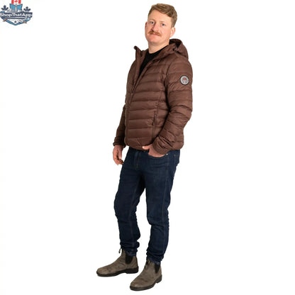 Northern Sun packable down jacket shown folded and packed in a small pouch, lightweight and ideal for travel and outdoor activities.