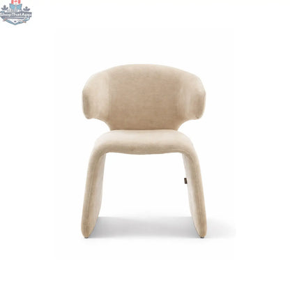 Oriana Sculpted Dining Chair by Hygge Design House, featuring a stylish modern design with curved backrest and wooden legs.