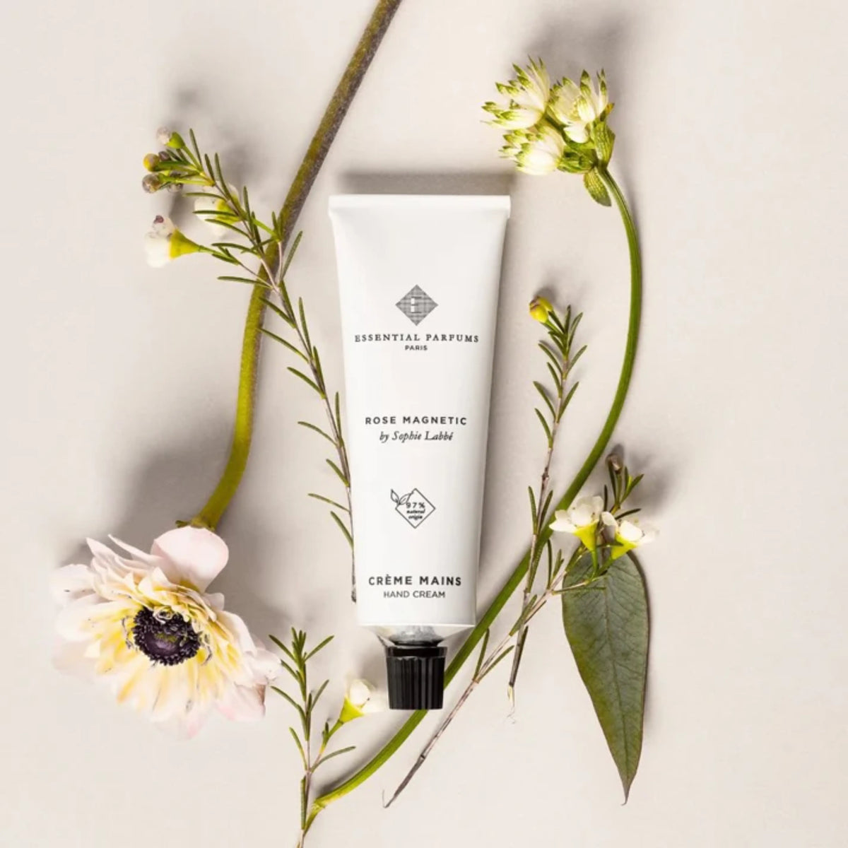 Essential Parfums Rose Magnetic Hand Cream in 50 ml tube, featuring a floral scent and nourishing formula for soft hands.