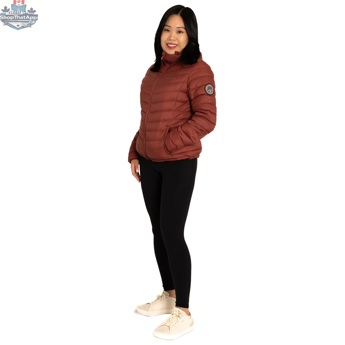Northern Sun packable down jacket, lightweight and insulated, shown folded and ready to wear. Ideal for travel and outdoor activities.
