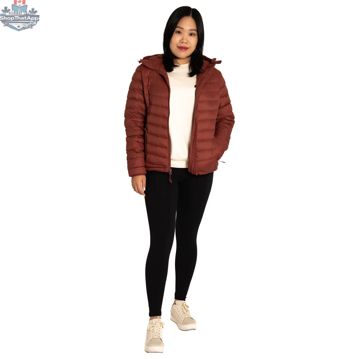 Northern Sun packable down jacket, lightweight and insulated, shown folded and partially unzipped for outdoor travel and layering.