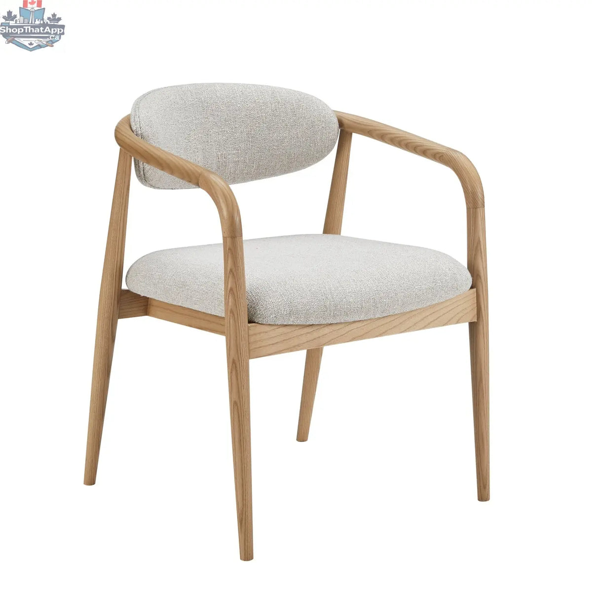 Hedda dining chair by Hygge Design House with wooden legs and upholstered beige fabric seat and backrest.