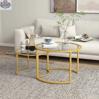 Modern nesting coffee tables with gold frames and tempered glass tops by SLOTH Nation, showcasing sleek, contemporary furniture design.