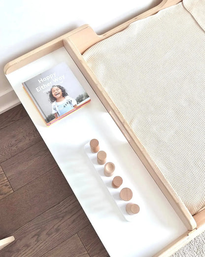 Apple Junior Montessori toddler floor bed with rails and shelves, made by Sapiens Child, designed for safe, easy access for little ones.