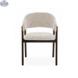 Fiol dining chair by Hygge Design House with beige upholstery and dirty oak wood frame, showcasing a modern, stylish design.