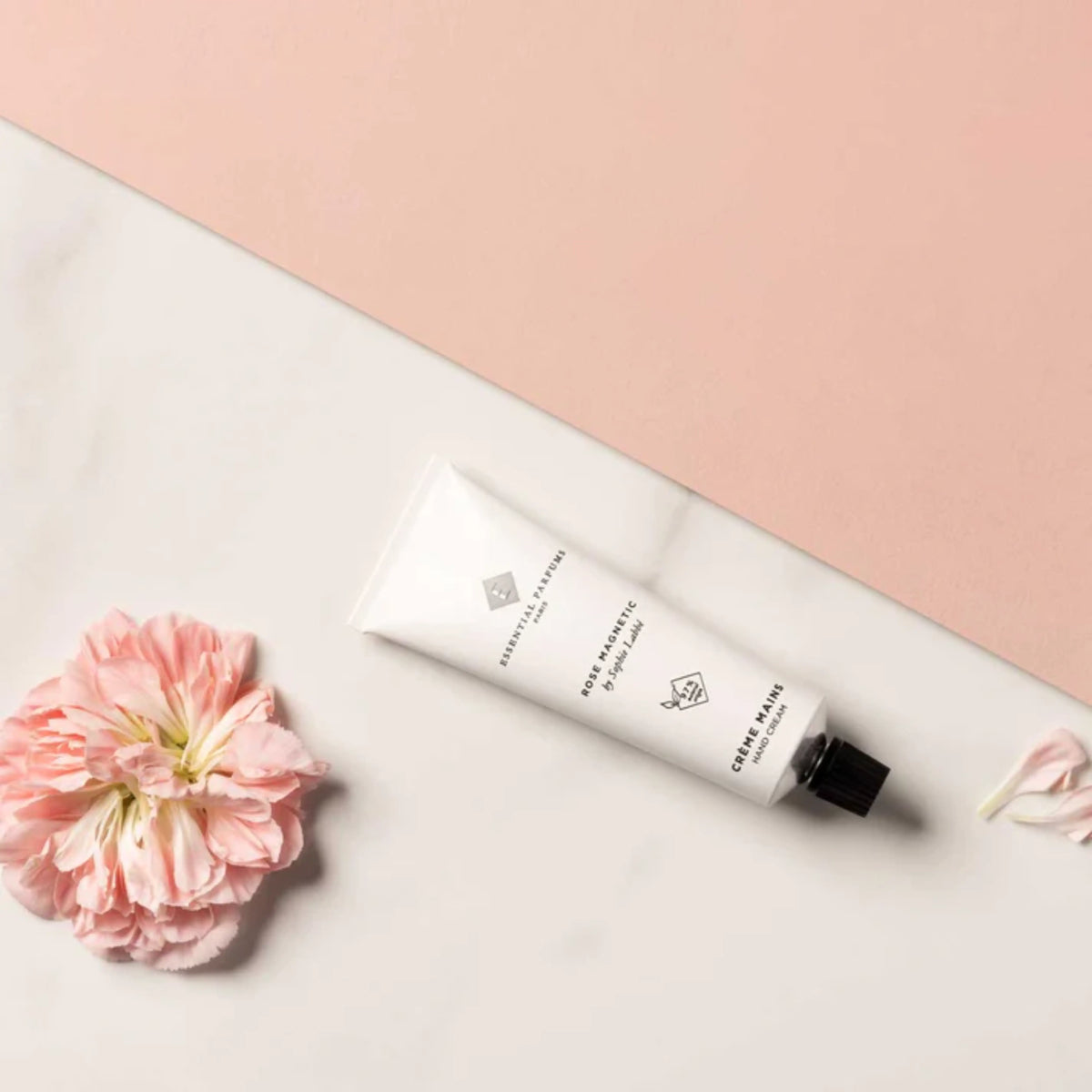 Essential Parfums Rose Magnetic Hand Cream 50ml from Onlyblooms Import Inc., showing elegant packaging and rose-scented hand cream tube.
