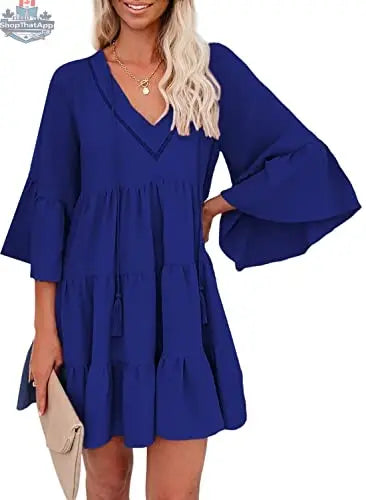 A woman wearing an AILUNSNIKA long sleeve mini dress with a V-neck, solid color, flowy and elegant for effortless style and comfort.