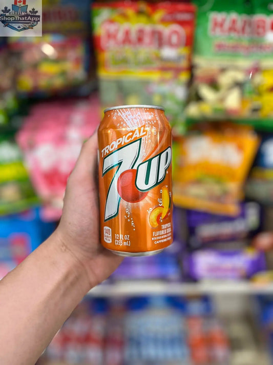 7UP Tropical citrus soft drink in a 335ml can, featuring vibrant tropical fruit branding and colorful label design.