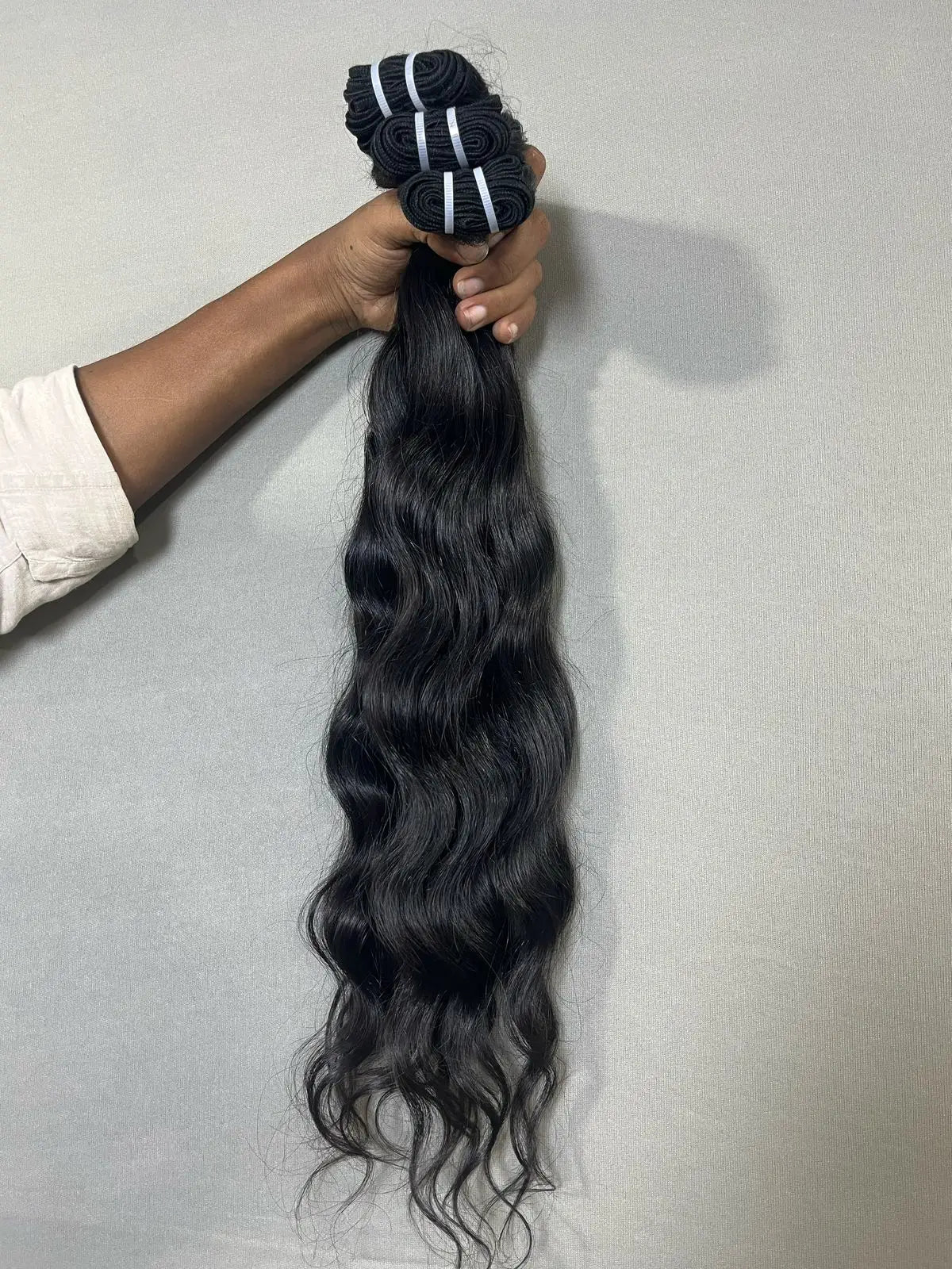 Indian raw wavy hair extensions bundles from Prithvi Mart with natural hair texture and rich waves.