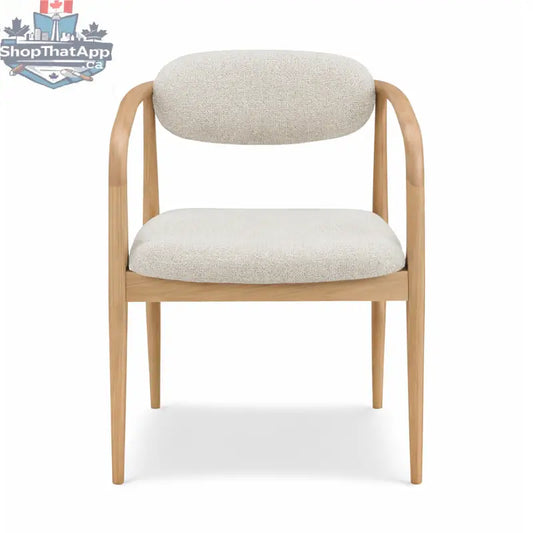 Hedda dining chair by Hygge Design House with wooden legs and upholstered seat in a modern, minimalist style.