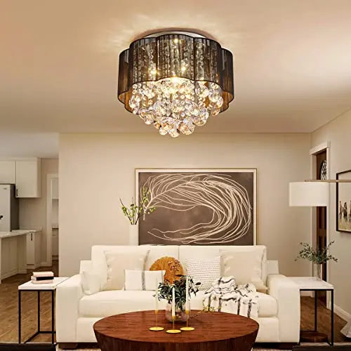 Elegant crystal ceiling light fixture by AGV LIGHTING with sparkling crystal accents and a polished metal frame.