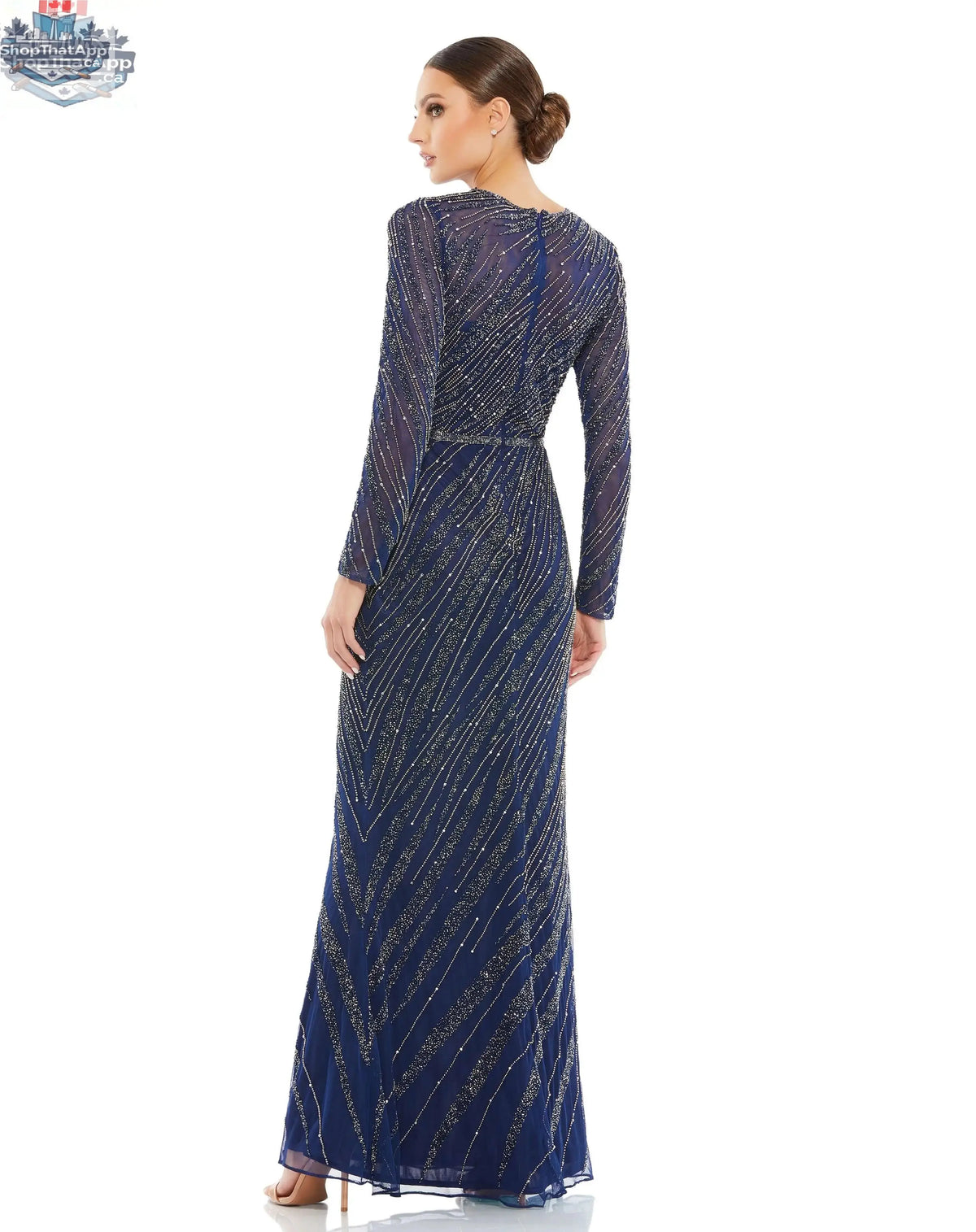 Elegant midnight blue long sleeve beaded evening gown by Elegant Threads, featuring intricate beadwork and a flowing silhouette.