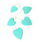 Set of five hanging wooden heart string decorations by Suzie Blue Canada, perfect for cozy home decor.