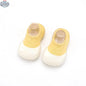 Wild Baby sock shoes featuring soft fabric and elastic ankle cuffs, designed for comfort and easy wear for infants.