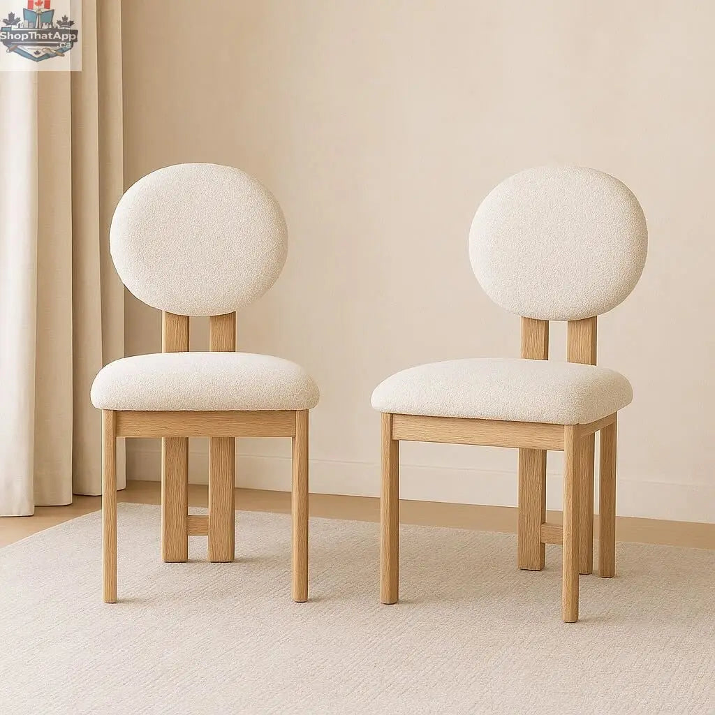 Modern Tova dining chair by Hygge Design House with wooden legs and upholstered seat, shown in a stylish dining room setting.