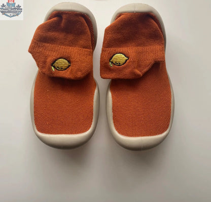 Wild Baby sock shoes for infants, soft fabric with colorful patterns, designed for comfortable and stylish little feet.
