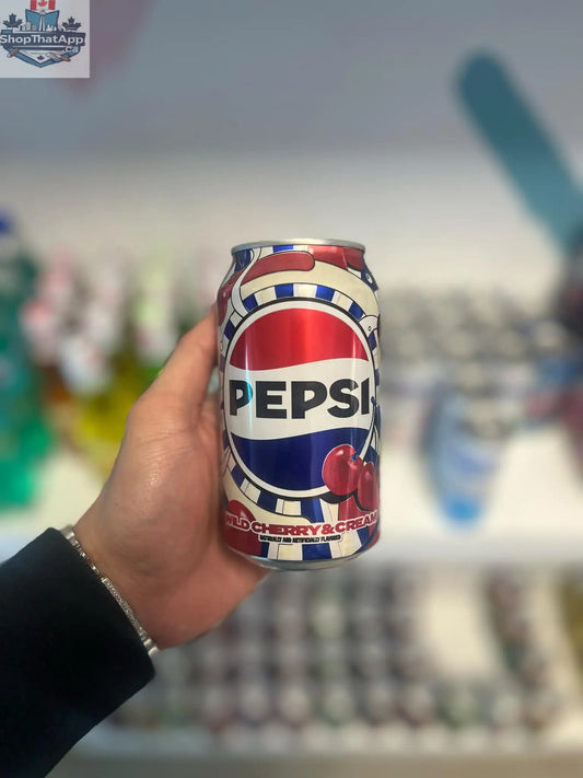 Pepsi Wild Cherry Cream Soda drink with fruity and creamy swirl in a clear glass, showcasing its vibrant red color.