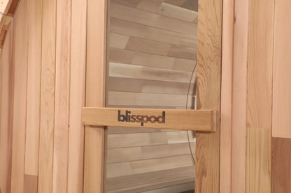Zoppinh Blisspod Canadian Red Cedar outdoor sauna in Prague with full glass back and two front porch seats for 2-6 persons.