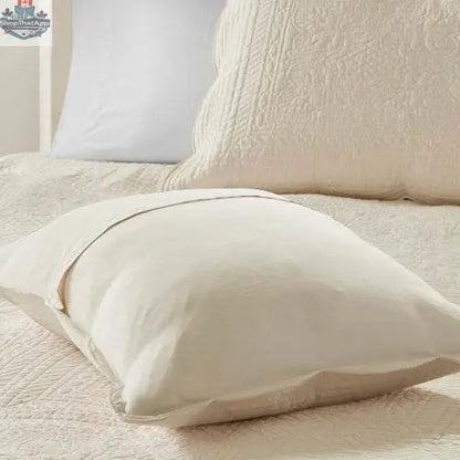 Reversible scalloped edge quilt set comforter by EX-STOCK Canada with floral and geometric patterns in neutral tones.