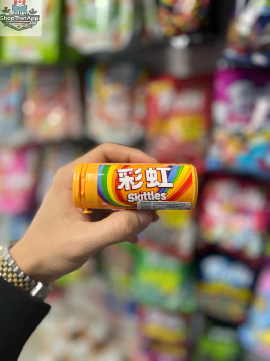 Colorful China Skittles Tube Rainbow Fruit Tea candy from Snack Bar Co, showcasing vibrant fruit-flavored candies in a clear tube.