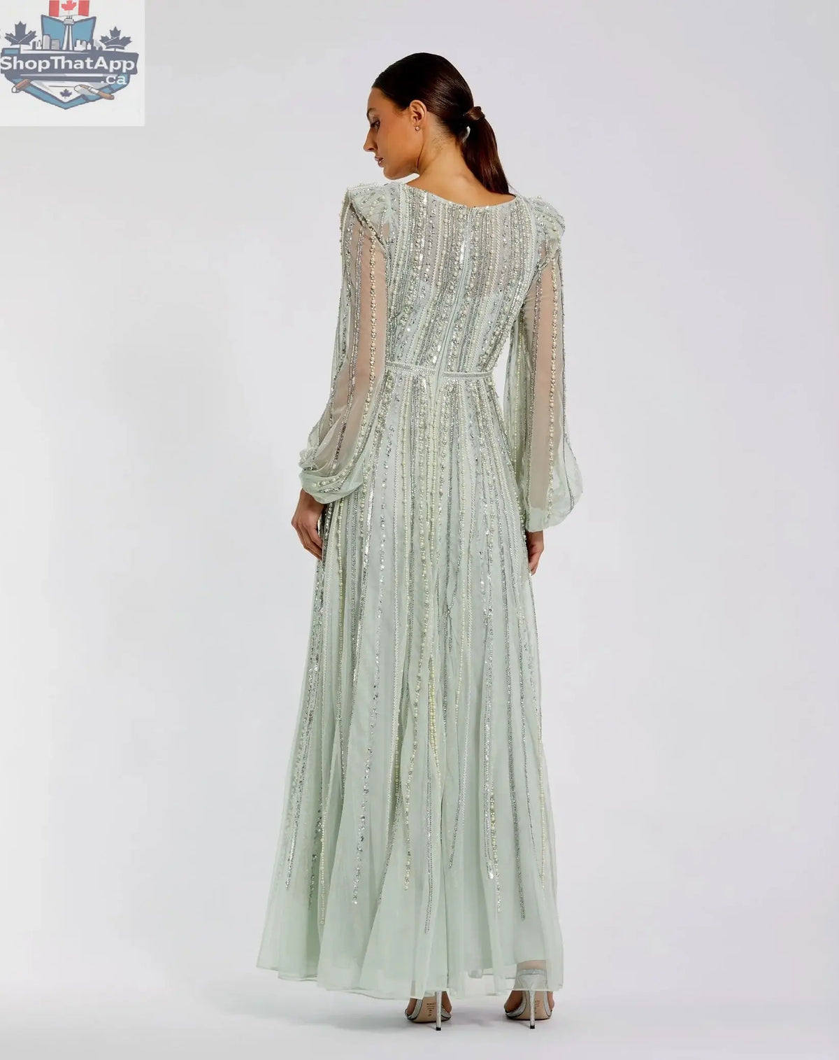 Elegant Threads mint boat neck evening gown with long sleeves and striped beading, showcasing intricate beadwork and stylish design.