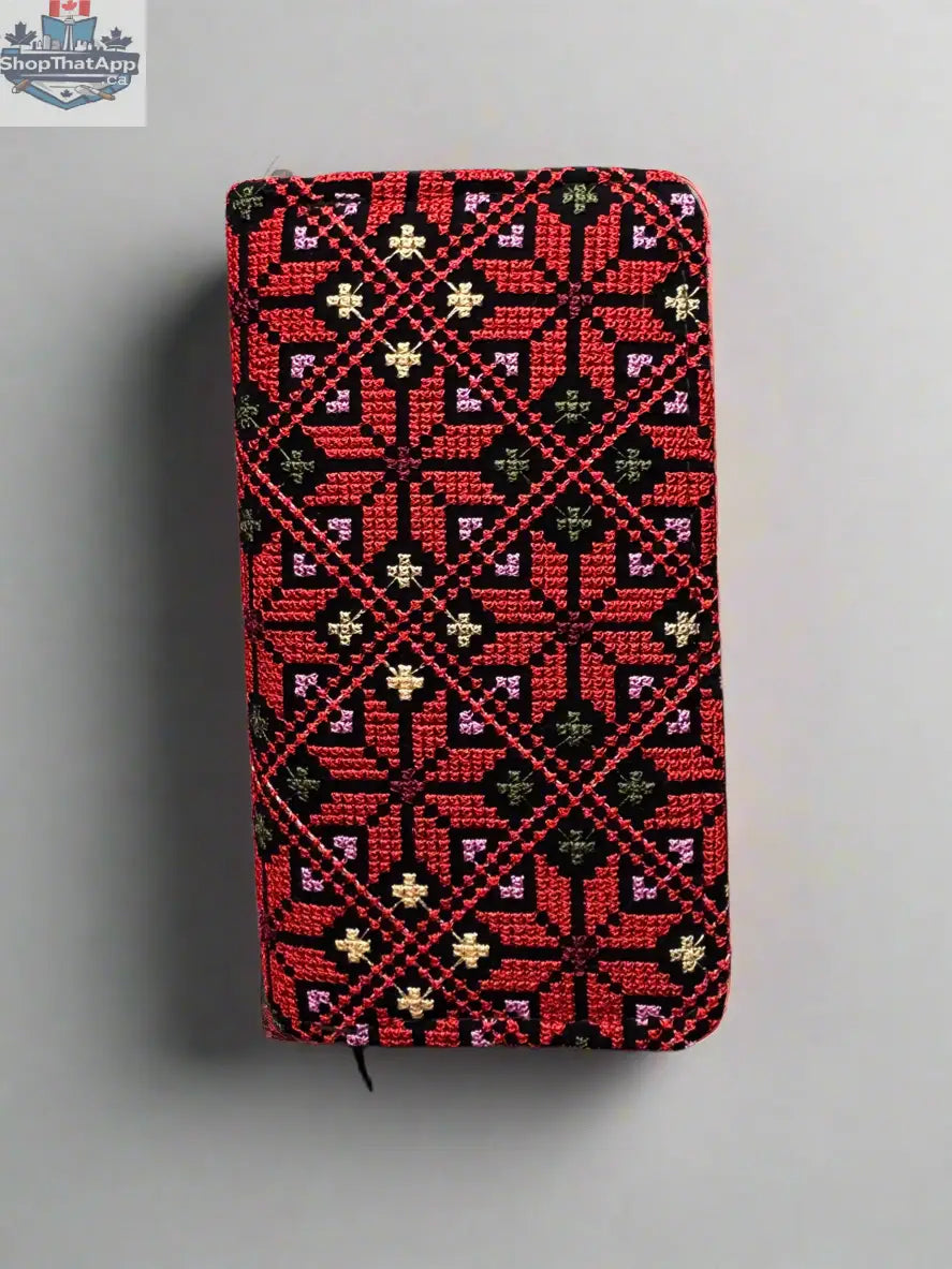 Handheld large Palestinian wallet by The Olive Tree in red, gold, watermelon, or kufiya pattern, featuring traditional Palestinian textile design.