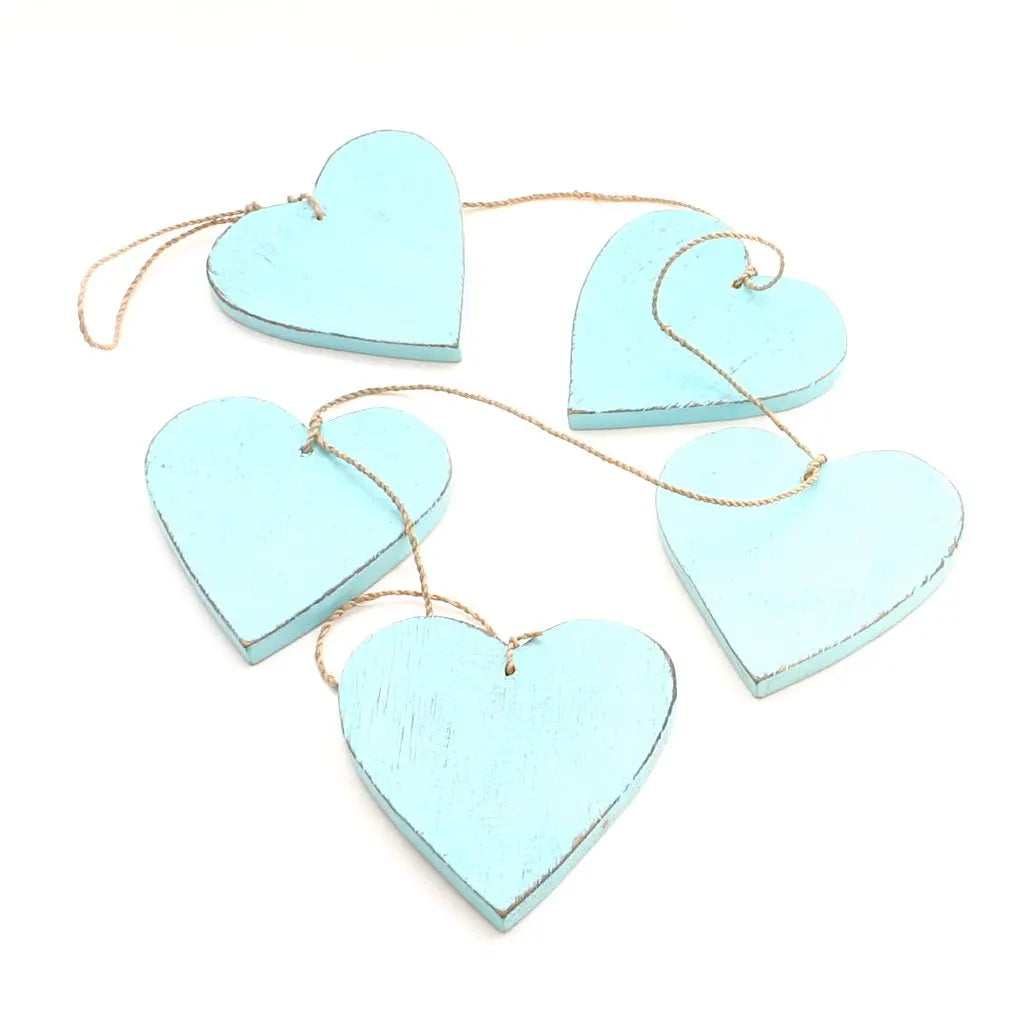 Set of five hanging wooden heart strings for home decor, featuring natural wooden hearts with rustic charm by Suzie Blue Canada.