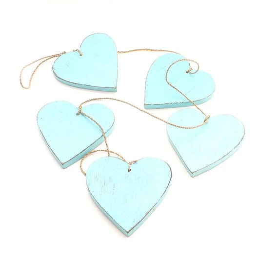 Set of five hanging wooden heart strings for home decor, featuring natural wooden hearts with rustic charm by Suzie Blue Canada.