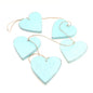 Set of five hanging wooden heart strings for home decor, featuring natural wooden hearts with rustic charm by Suzie Blue Canada.