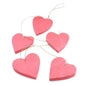 Set of five hanging wooden heart string decorations, natural wood finish, perfect for home decor by Suzie Blue Canada.