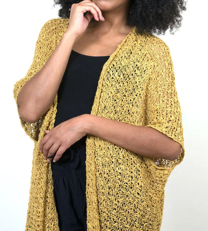 Mid-length mustard popcorn knit kimono by Suzie Blue Canada, shown with a relaxed fit and textured fabric.