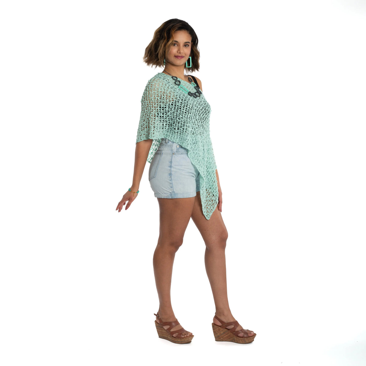 Mint popcorn knit poncho top by Suzie Blue Canada featuring a lightweight, cozy design with a relaxed fit.