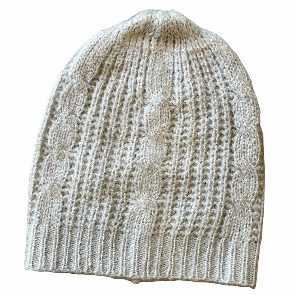 Suzy Blue Canada cable knit hat showcasing a cozy, stylish hat with a textured cable knit pattern and a snug fit.
