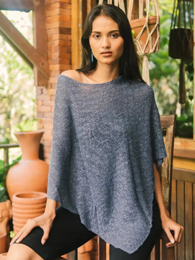 Double knit popcorn poncho in denim blue by Suzie Blue Canada, showcasing its cozy knitwear design and textured pattern.