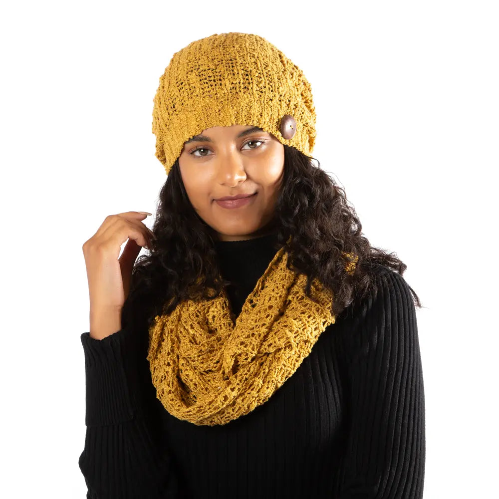 Mustard popcorn knit hat with button detail from Suzie Blue Canada, featuring a cozy, textured knit design and stylish button accents.