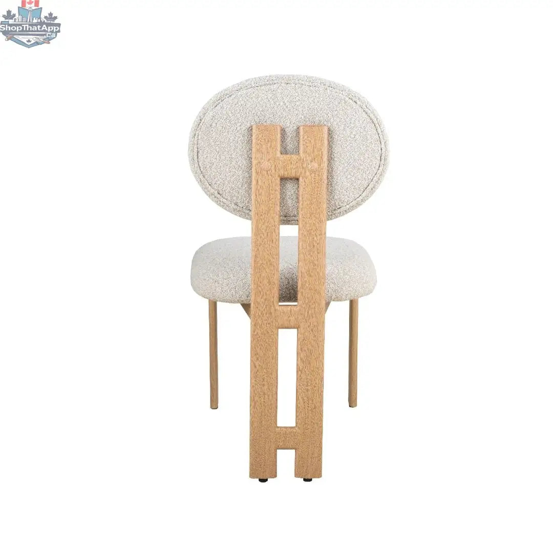 Hygge Design House Tova dining chair with wooden legs and upholstered seat, modern Scandinavian style for dining room.
