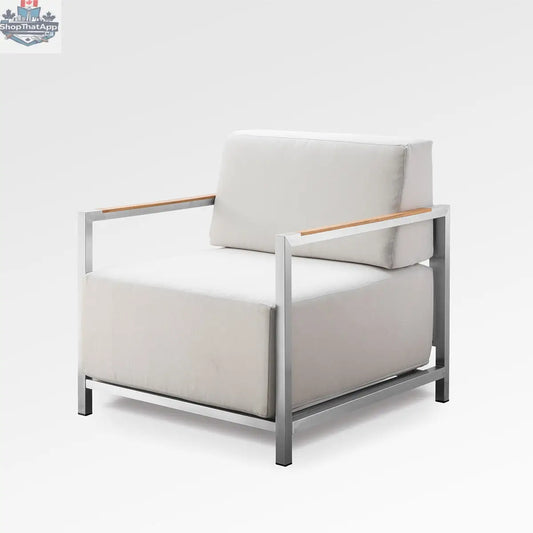 Enclover Acacia lounge chair with silver frame and Sunbrella cushions, designed for stylish outdoor relaxation.