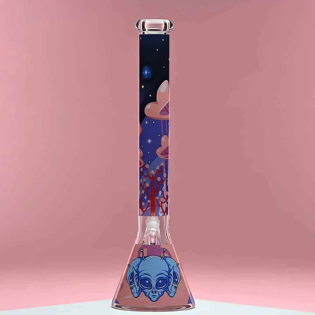Castle Glassworks 18-inch alien-themed beaker bong made of 9mm thick glass with a pink background.