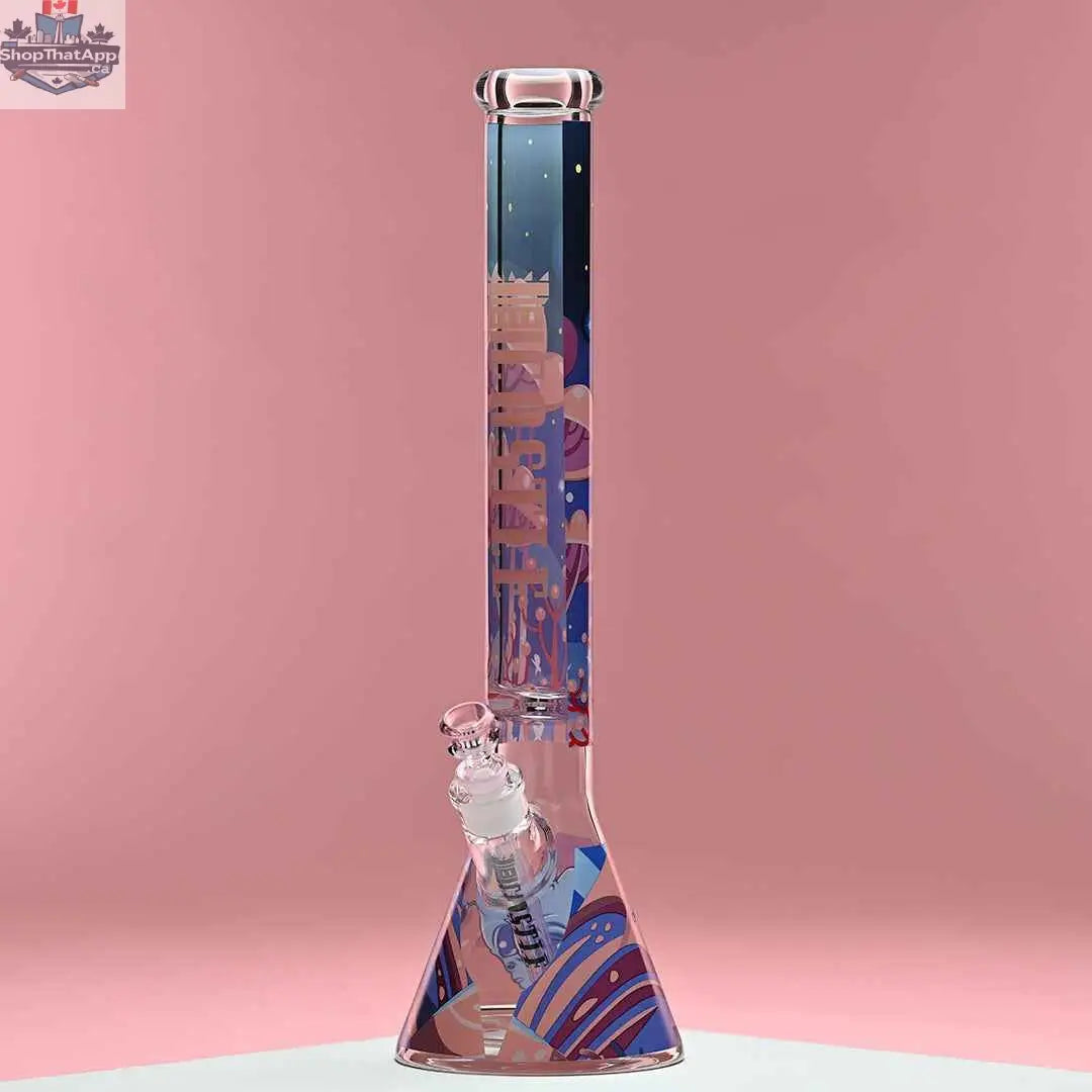 18-inch Alien beaker bong by Castle Glassworks with 9mm thick glass and alien design, set against a pink background.